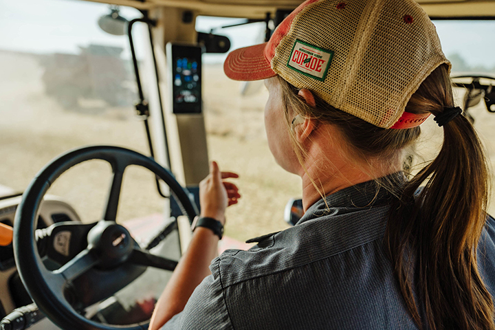 Woman operating a farm vehicle